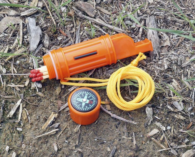 5-IN-1 Orange Survival Whistle with Lanyard outdoors