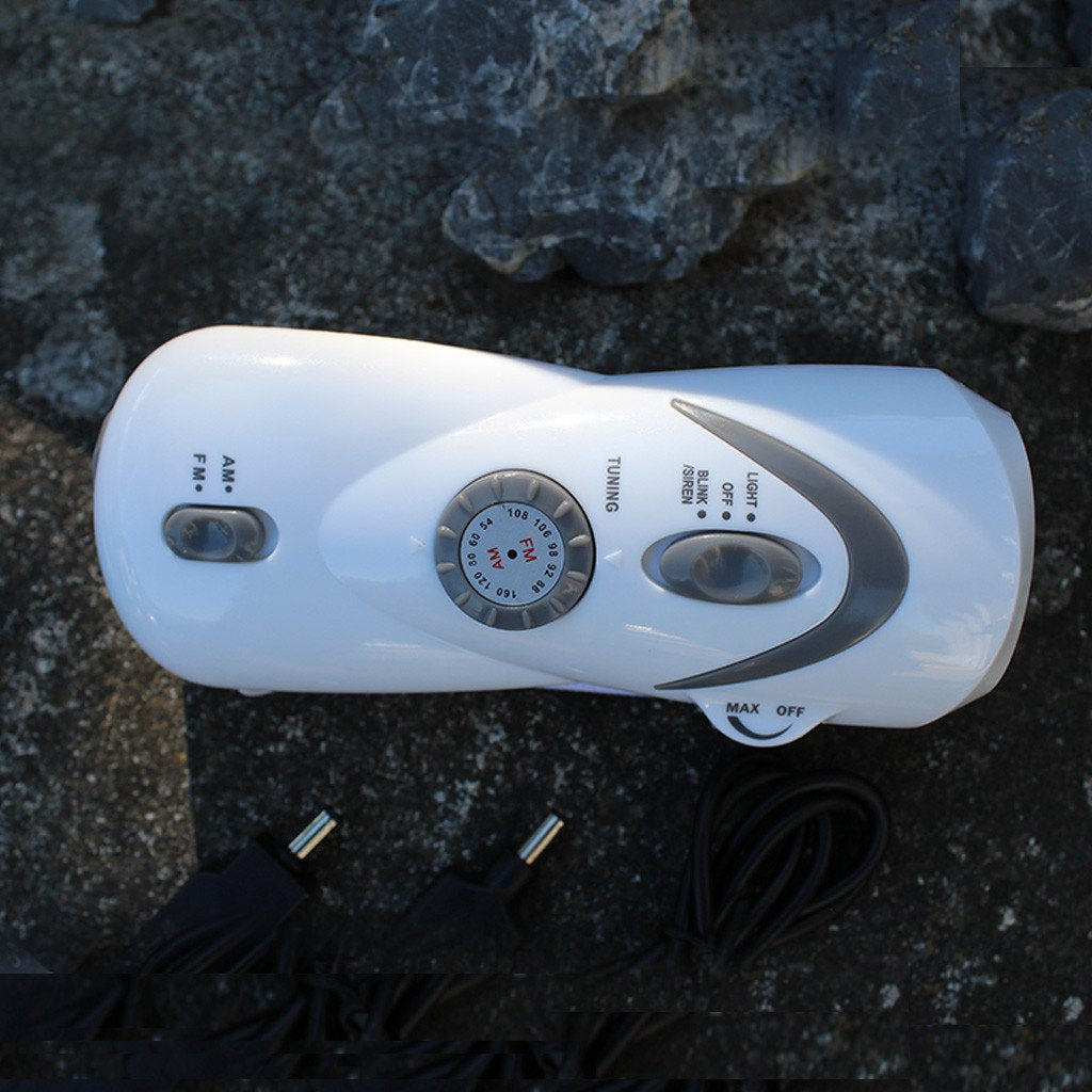 hand-crank light and radio with USB device charger outside